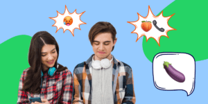 Teenage boy and girl looking at mobile phones with emoji messages
