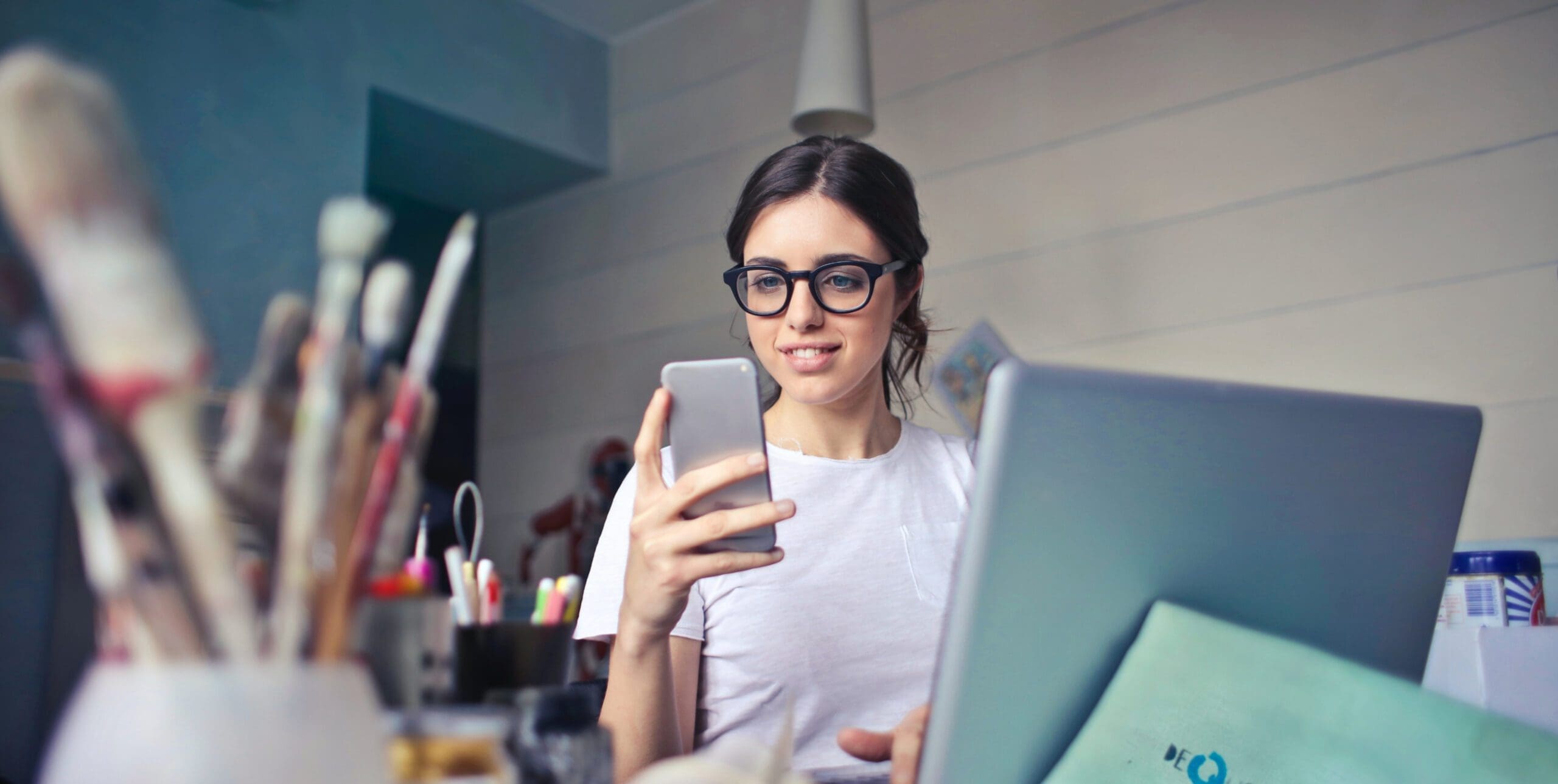 Woman sitting at desk wanting to contact us